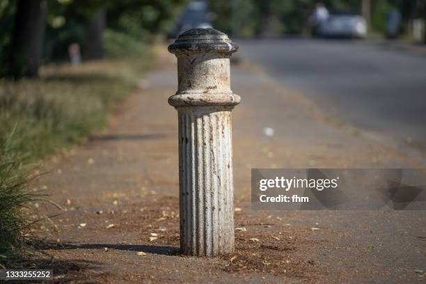 bollard on the street - pegão imagens e fotografias de stock