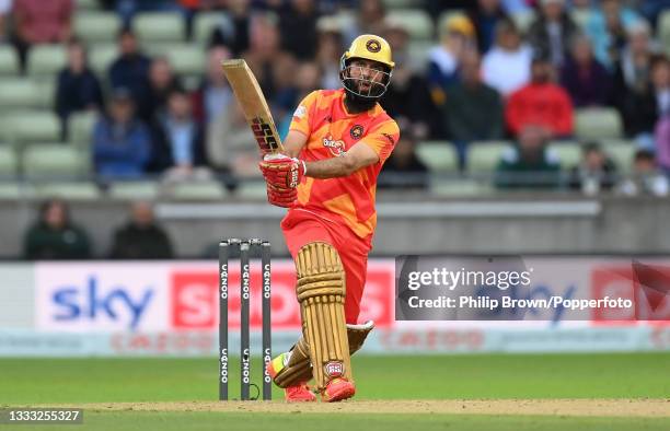 Moeen Ali of Birmingham Phoenix hits in the air and is caught during The Hundred match between Birmingham Phoenix Men and Welsh Fire Men at Edgbaston...