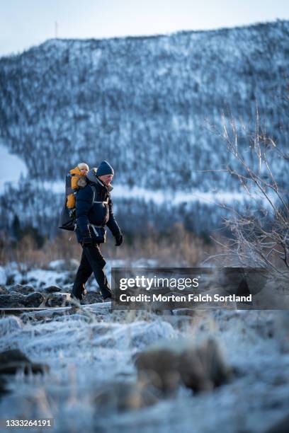 grandfather and grandchild enjoying a hike in the snow - buskerud stock pictures, royalty-free photos & images