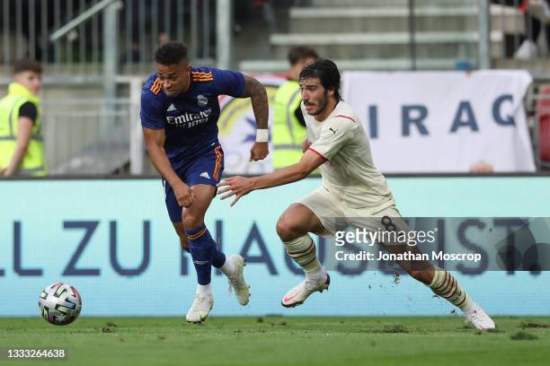 Mariano Diaz of Real Madrid fights for the ball against Sandro Tonali of AC Milan during the Pre-season friendly match between Real Madrid and AC...