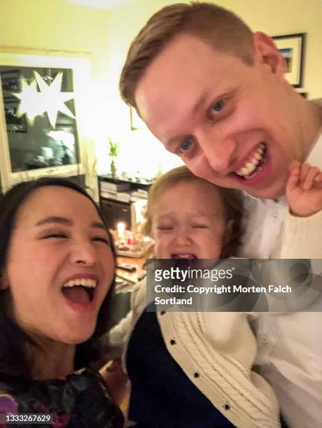 selfie of a loving family in vestland, norway - chinese family taking photo at home stock pictures, royalty-free photos & images