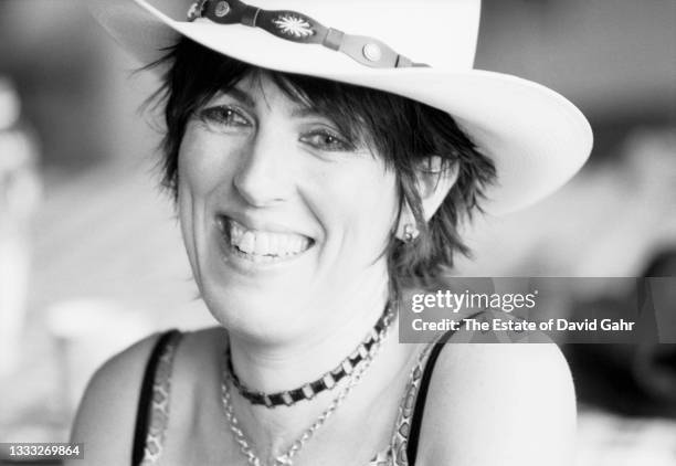 American singer songwriter and guitarist Lucinda Williams poses for a portrait backstage in August, 1998 at the Newport Folk Festival in Newport,...