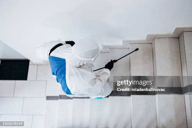 spraying, disinfection and decontamination - sproeier stockfoto's en -beelden