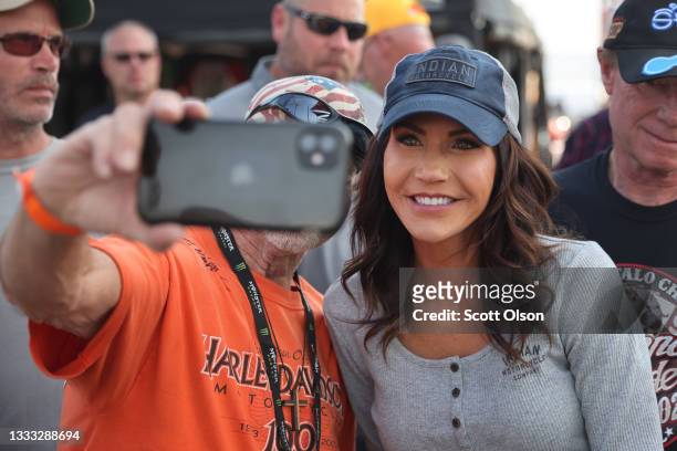 Governor Kristi Noem of South Dakota greets guests at the Sturgis Buffalo Chip campground after riding in the Legends Ride for charity on August 09,...