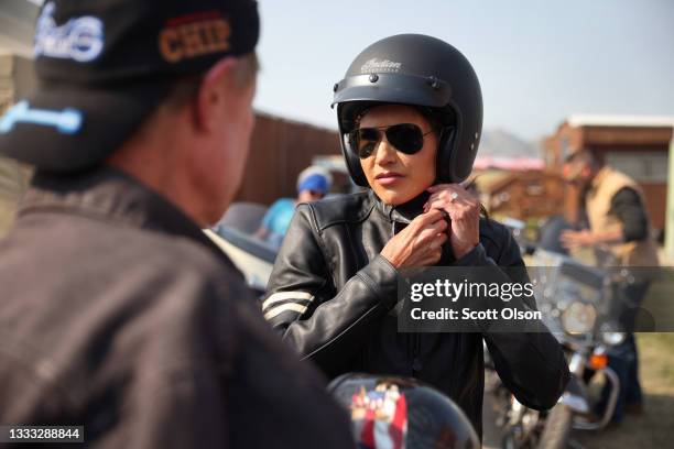 Governor Kristi Noem of South Dakota arrives at the Sturgis Buffalo Chip campground after riding in the Legends Ride for charity on a 2021 Indian...