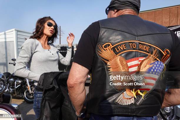 Governor Kristi Noem of South Dakota arrives at the Sturgis Buffalo Chip campground after riding in the Legends Ride for charity on a 2021 Indian...