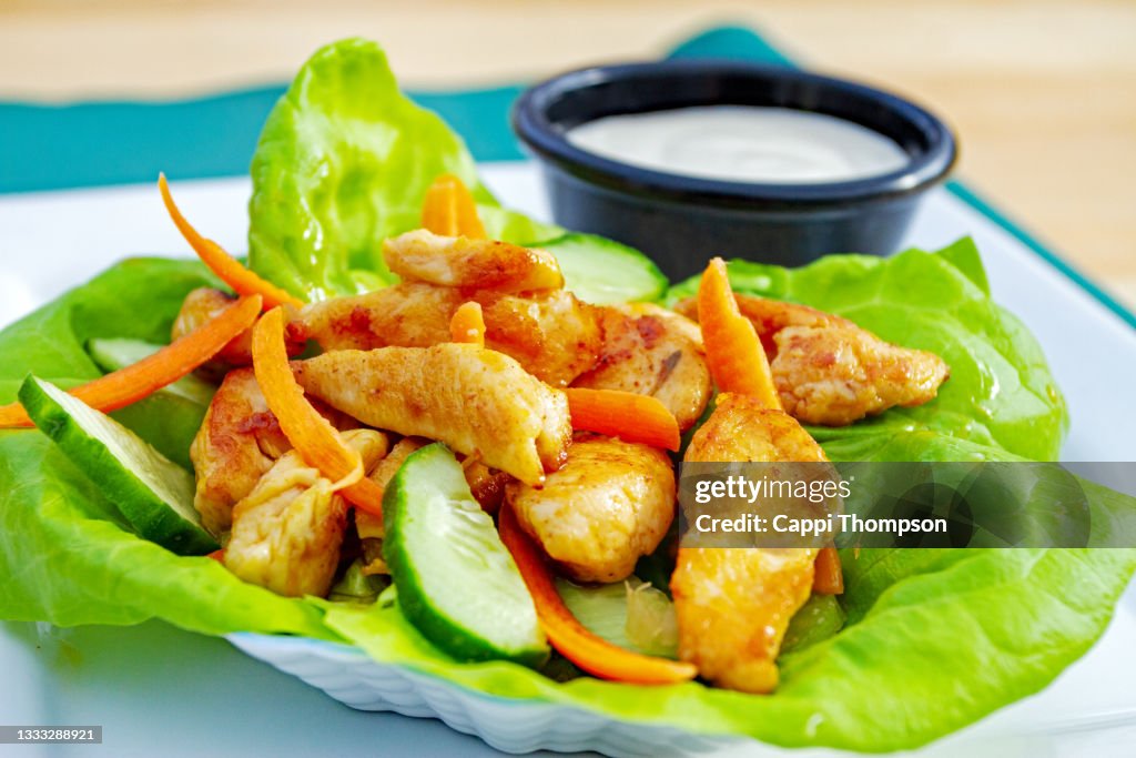 Spicy Buffalo Chicken lettuce wrap with blue cheese sauce