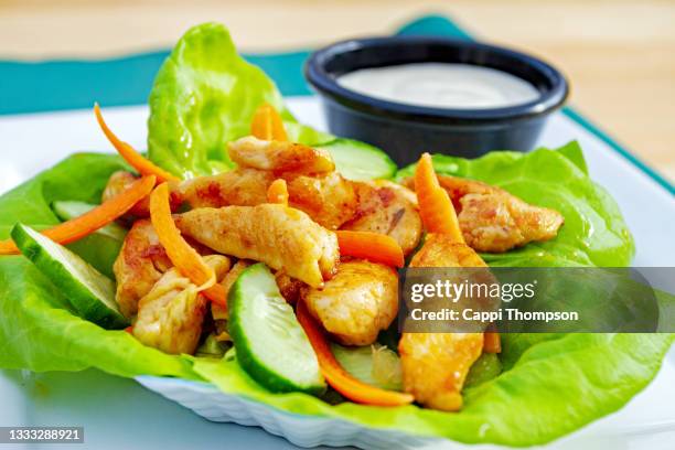 spicy buffalo chicken lettuce wrap with blue cheese sauce - buffalo chicken lettuce stock pictures, royalty-free photos & images