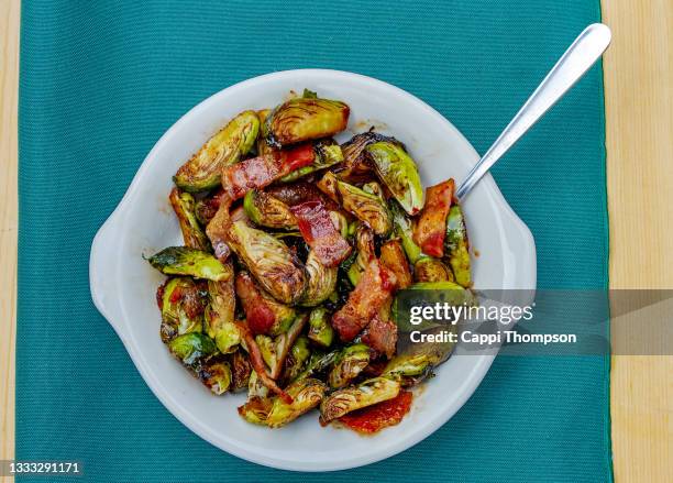 brussel sprouts and bacon appetizer dish - brussel sprout stock pictures, royalty-free photos & images
