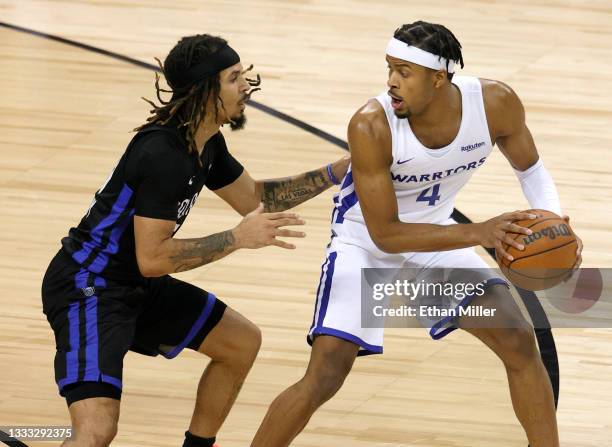 Moses Moody of the Golden State Warriors is guarded by Cole Anthony of the Orlando Magic during the 2021 NBA Summer League at the Thomas & Mack...