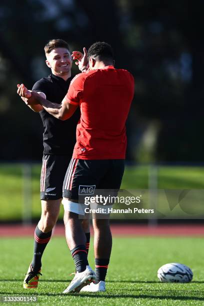 Beauden Barrett and Hoskins Sotutu run through drills during a New Zealand All Blacks training session at Waitakere Stadium on August 10, 2021 in...