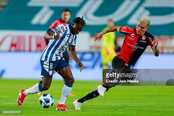 Aviles Hurtado of Pachuca fights for the ball with Luis Ricardo Reyes of Atlas during the 3rd round match between Pachuca and Atlas as part of the...