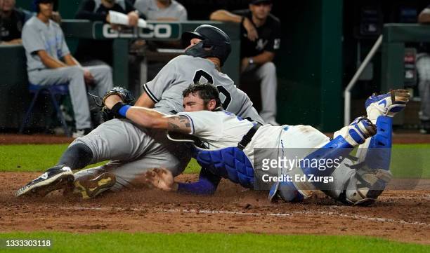 Aaron Judge of the New York Yankees is tagged out by Cam Gallagher of the Kansas City Royals at the plate in the seventh inning at Kauffman Stadium...