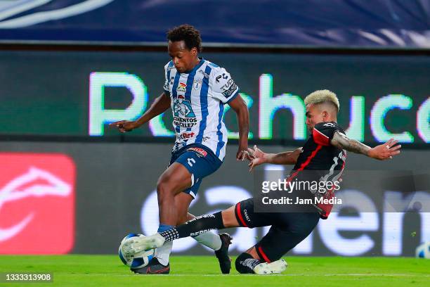 Romario Andres Ibarra of Pachuca fights for the ball with Luis Ricardo Reyes of Atlas during the 3rd round match between Pachuca and Atlas as part of...
