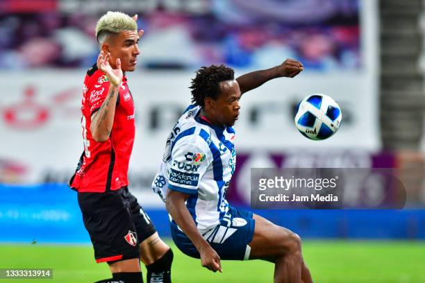 Luis Ricardo Reyes of Atlas fights for the ball with Romario Andres Ibarra of Pachuca during the 3rd round match between Pachuca and Atlas as part of...