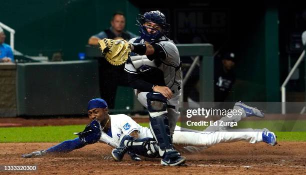 Jarrod Dyson of the Kansas City Royals scores past Kyle Higashioka of the New York Yankees in the seventh inning at Kauffman Stadium on August 09,...