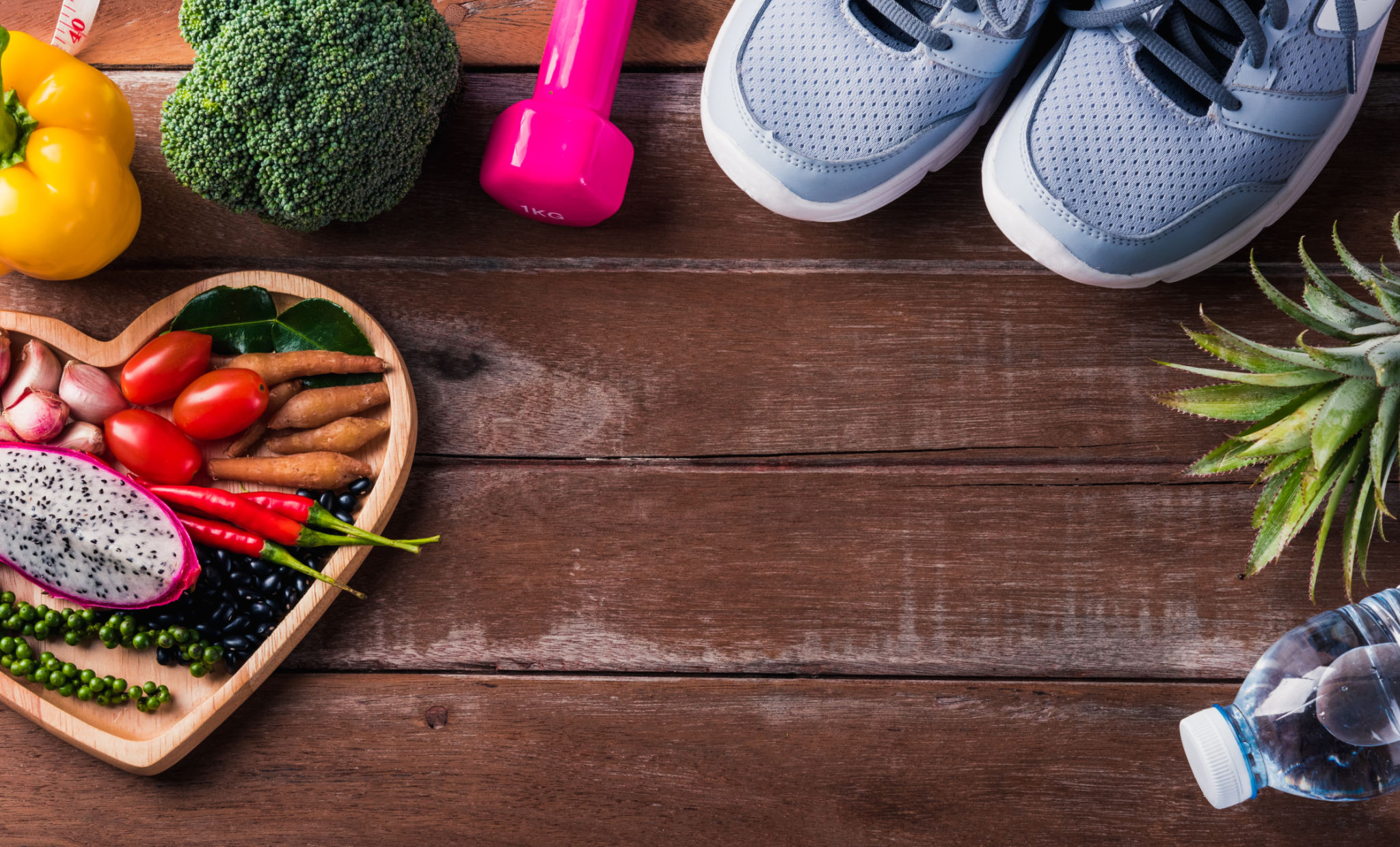 fruit and vegetable in heart plate and sports shoes, dumbbell and water fruit and vegetable in heart plate and sports shoes, dumbbell and water