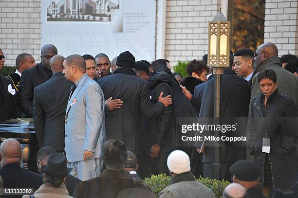 Friend and family console each other at the funeral service for Heavy D at Grace Baptist Church on November 18, 2011 in Mount Vernon, New York.