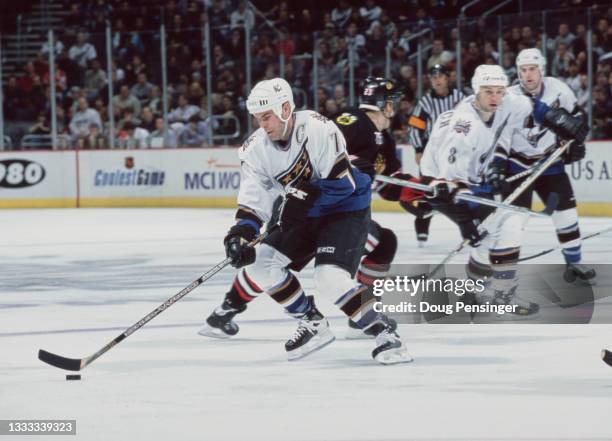 Adam Oates, Captain and Center for the Washington Capitals in motion on the ice during the NHL Eastern Conference Southeast Division game against the...