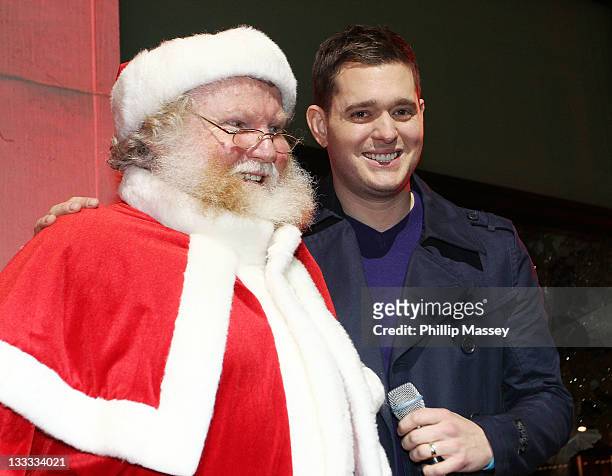 Santa Claus and Michael Buble attend the launch of Brown Thomas' Christmas windows on November 18, 2011 in Dublin, Ireland.