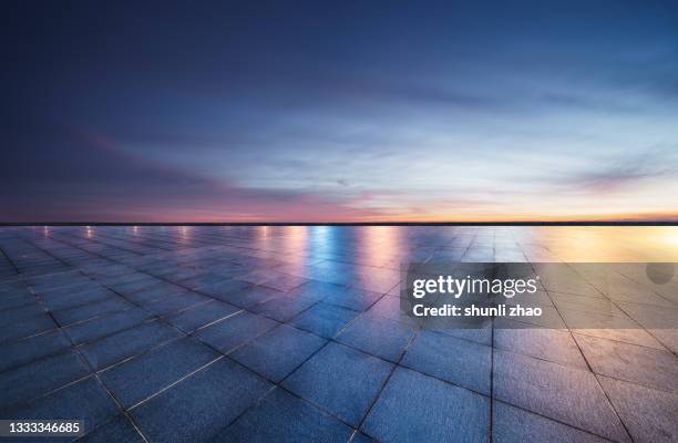 empty ground against cloud sky at night - construction material ストックフォトと画像