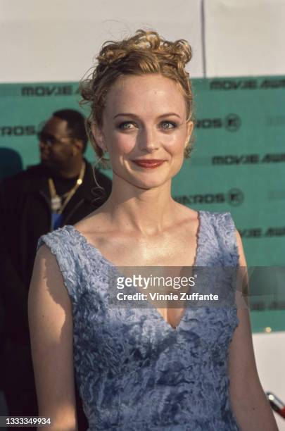 American actress Heather Graham, wearing a blue v-neck dress, attends the 7th Annual MTV Movie Awards, held at Barker Hangar at Santa Monica Airport...