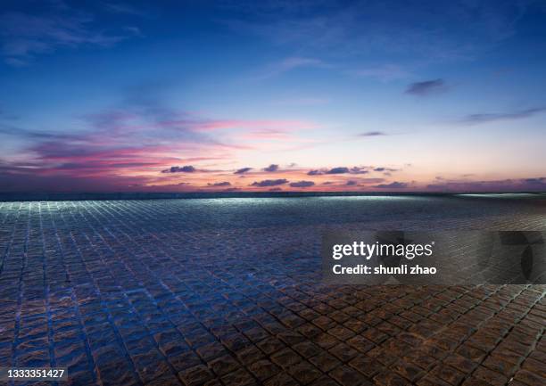 empty ground against cloud sky at night - city dusk stock pictures, royalty-free photos & images