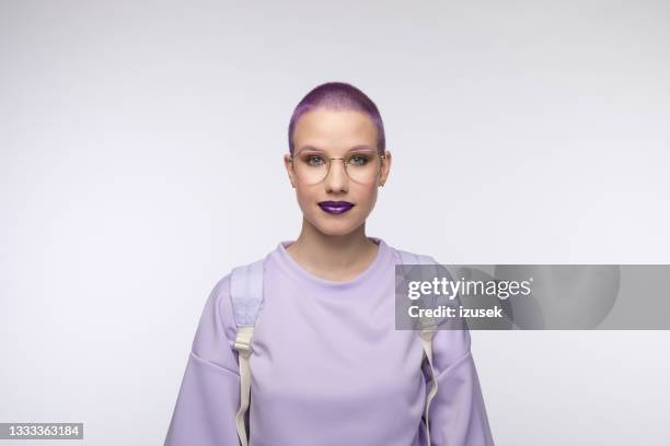 friendly female student with short purple hair - woman white background glasses stock pictures, royalty-free photos & images