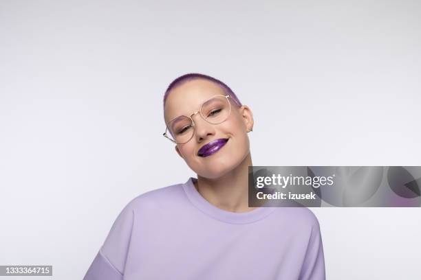 young woman with short purple hair - purple blouse stock pictures, royalty-free photos & images