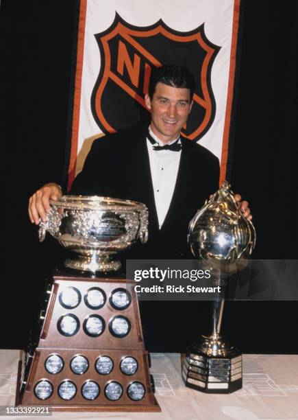 Mario Lemieux, Captain and Center for the Pittsburgh Penguins poses with the Hart Memorial Trophy for the most valuable player of the National Hockey...