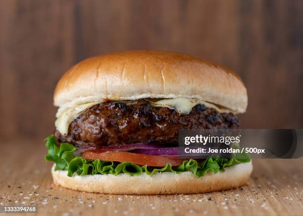 close-up of burger on table,dallas,texas,united states,usa - plain burger stock pictures, royalty-free photos & images