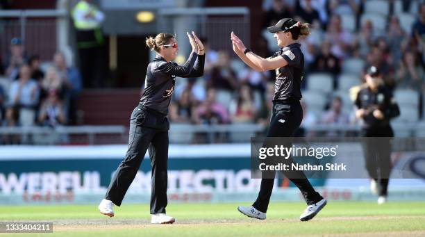 Alex Hartley of Manchester Originals Women celebrates with Kate Cross after she catches Naomi Dattani of London Spirit Women out during The Hundred...