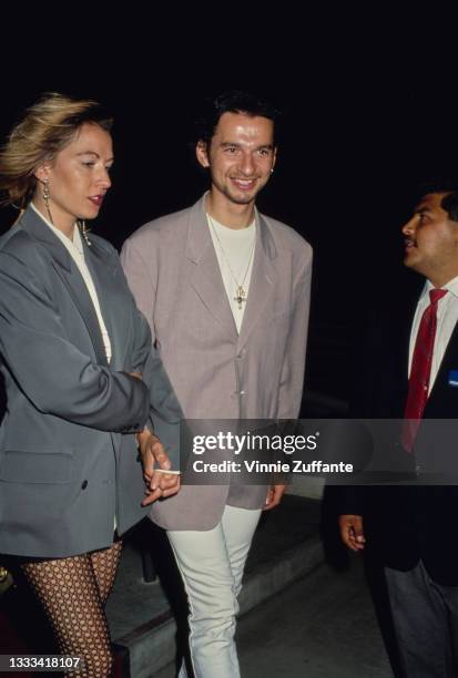 British singer-songwriter Dave Gahan, wearing a grey blazer over a white top, and white trousers, , and his wife, American publicist Teresa Conroy...