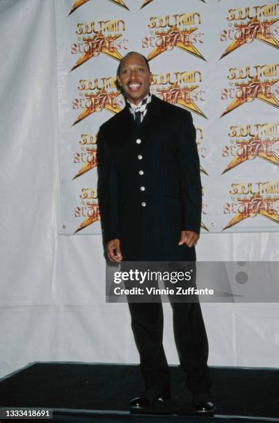 American singer-songwriter Jeffrey Osborne, wearing a black suit with a black-and-white checked shirt, attends the 2nd Annual Soul Train Christmas...