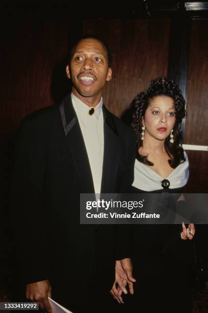 American singer-songwriter Jeffrey Osborne, wearing a black suit with a white shirt, and his wife Sheri, wearing a black off-shoulder dress, at an...