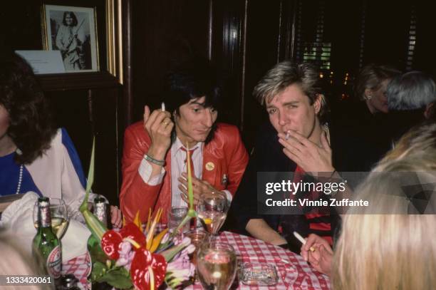 British guitarist, songwriter and artist Ronnie Wood and British musician, singer, and songwriter Simon Le Bon attend the opening of the Hard Rock...