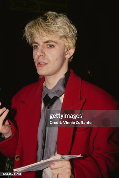 British keyboard player and singer Nick Rhodes, wearing a red blazer over a grey shirt, location unspecified, circa 1988. Rhodes is a founding member...