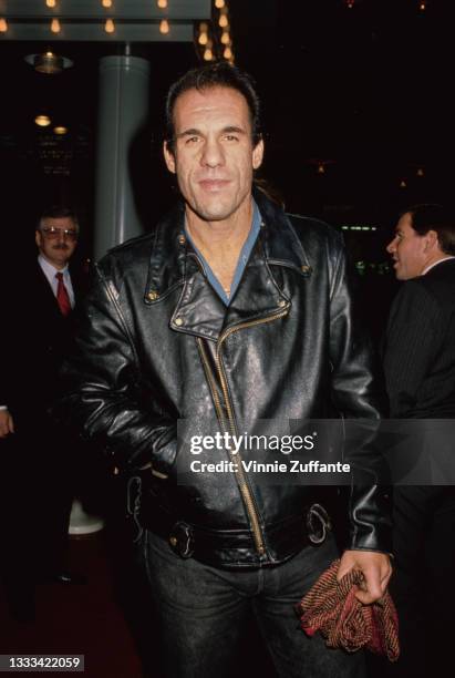 American actor and singer Robert Davi, wearing a black leather jacket, attends the Century City premiere of 'Twins', held at the AMC Century 14...