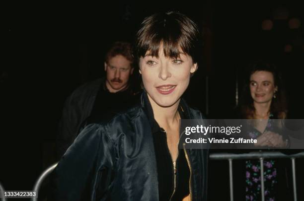 British actress Amanda Donohoe, wearing a black flight jacket, attends the premiere of 'Mississippi Masala' held at the Cineplex Odeon Cinema in...