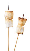 Fried marshmallows on skewers on a white plate, cut marshmallows. Isolated