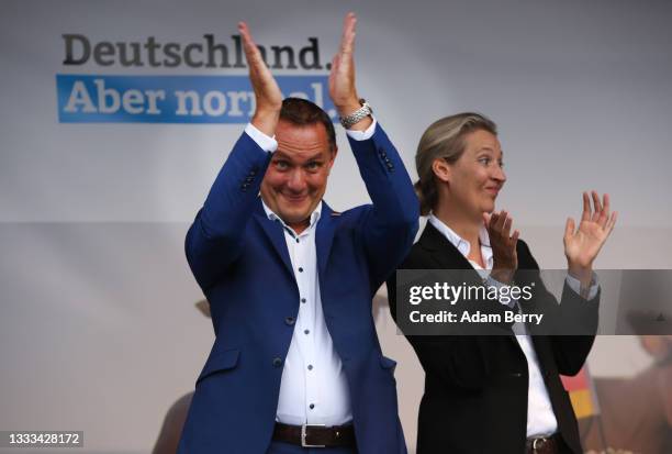 Tino Chrupalla and Alice Weidel, co-lead candidates for the Alternative for Germany party, applaud supporters at an AfD campaign rally on August 10,...