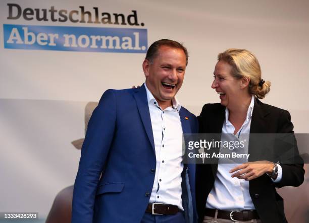 Tino Chrupalla and Alice Weidel, co-lead candidates for the Alternative for Germany party, acknowledge supporters at an AfD campaign rally on August...