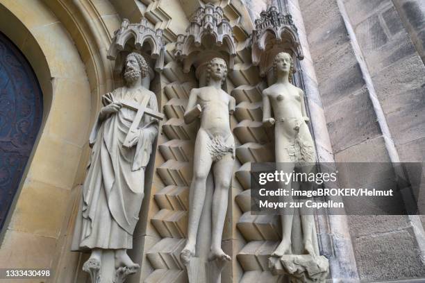 sculptures at the adam's gate around 1230, the first dompatron peter, on the right adam and eve, bamberg cathedral, bamberg, upper franconia, bavaria, germany - adam biblical figure stock pictures, royalty-free photos & images