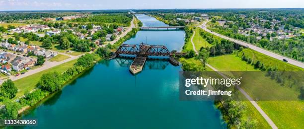 abandoned railroad bridge over the old welland canal, welland, canada - welland canal stock pictures, royalty-free photos & images