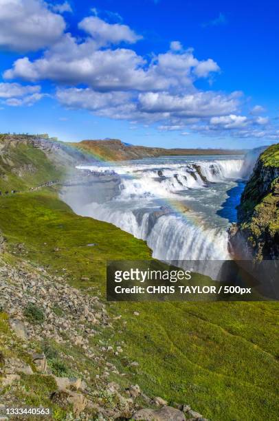 scenic view of waterfall against sky,gullfoss falls,iceland - gullfoss falls stock-fotos und bilder