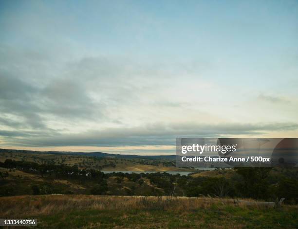 scenic view of landscape against sky,bathurst,new south wales,australia - top of the mountain australia stock pictures, royalty-free photos & images