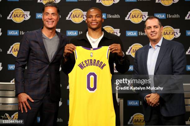 General manager Rob Pelinka, Russell Westbrook and head coach Frank Vogel of the Los Angeles Lakers pose for a picture during a press conference at...