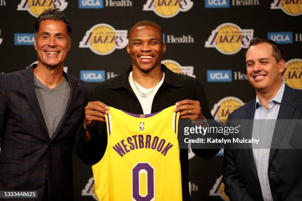 General manager Rob Pelinka, Russell Westbrook and head coach Frank Vogel of the Los Angeles Lakers pose for a picture during a press conference at...