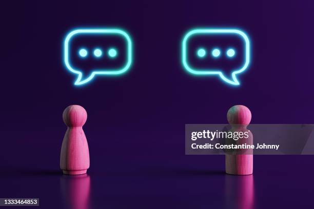 two wooden people figures communicating - face to face interview stock pictures, royalty-free photos & images