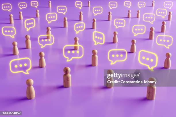 mass wooden people figures communication and discussion - rumor stockfoto's en -beelden